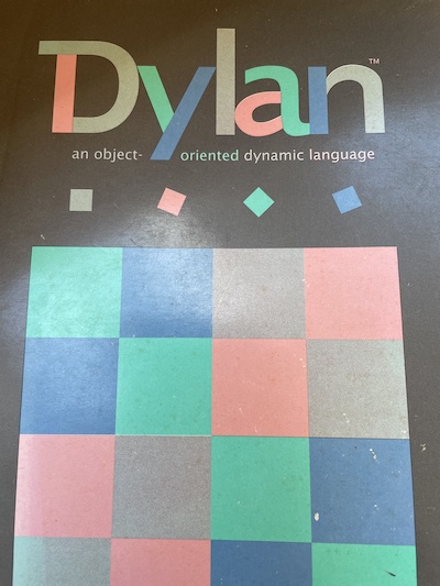 Cover of a book with a pastel square-theme image. Titled Dylan, an object-oriented dynamic language